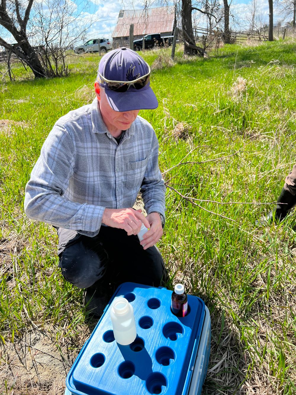 Water samples being taken for ongoing water sample analysis along the Bruce Peninsula.